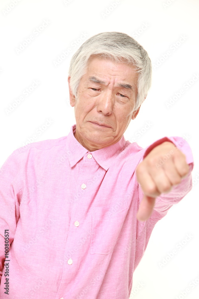 senior Japanese man with thumbs down gesture senior Japanese man with thumbs down gesture
