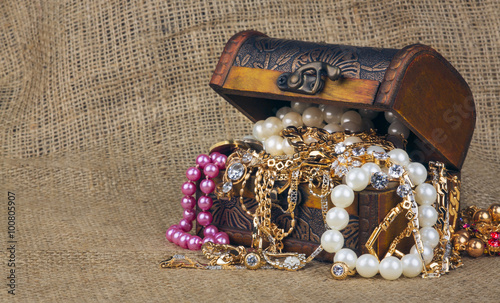 box with jewelry on sacking