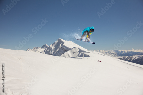Flying snowboarder on mountains. Extreme sport. © Vasily Merkushev