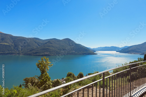 Panoramic of Lake Maggiore  part of Italian Switzerland. A very bland sunny day in pina estat with an intense blue lake