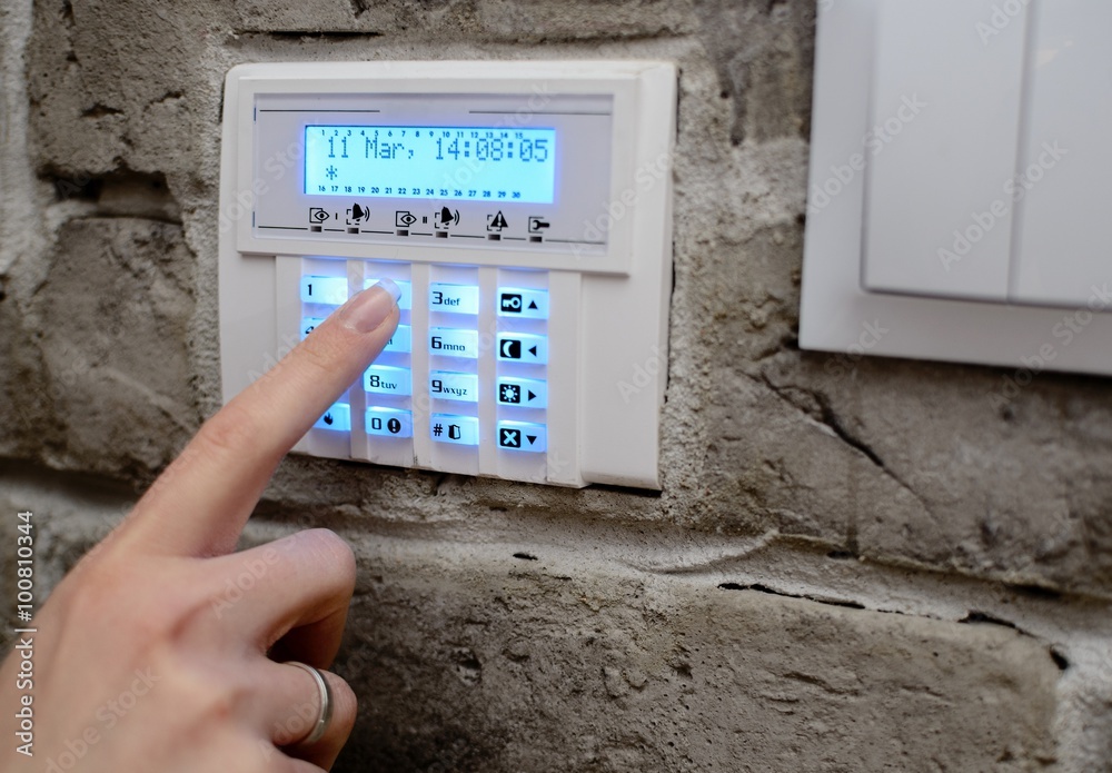 Closeup on woman's finger entering code
