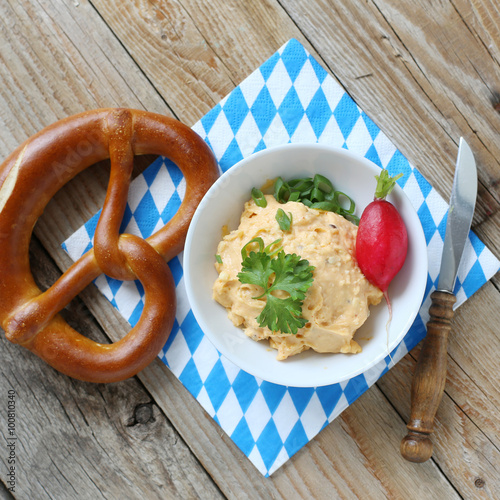 Fresh german Pretzel with Obatzda cheese photo