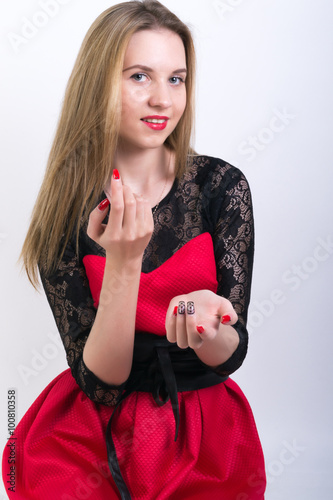 Close-up of attractive woman making hand gesture beckoning