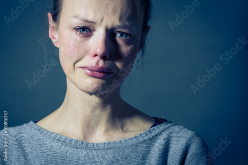 Young woman suffering from severe depression/anxiety/sadness photo