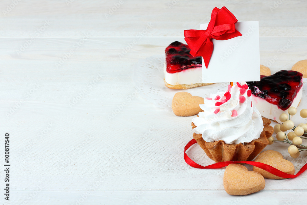 cake with jam and cookies in the shape of heart on wooden table cake with jam and cookies in the shape of heart on wooden table