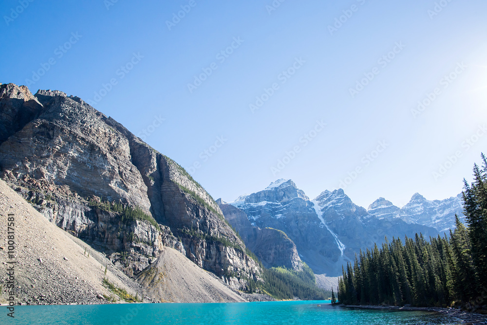 kayaks sailing on the turquoise waters of moraine lake in the national park of banff in the rocky mountains of alberta 