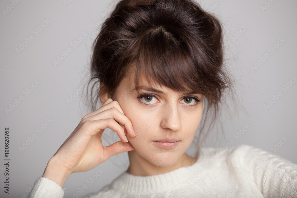 Close up portrait of serious brunette female model Close up portrait of serious brunette female model