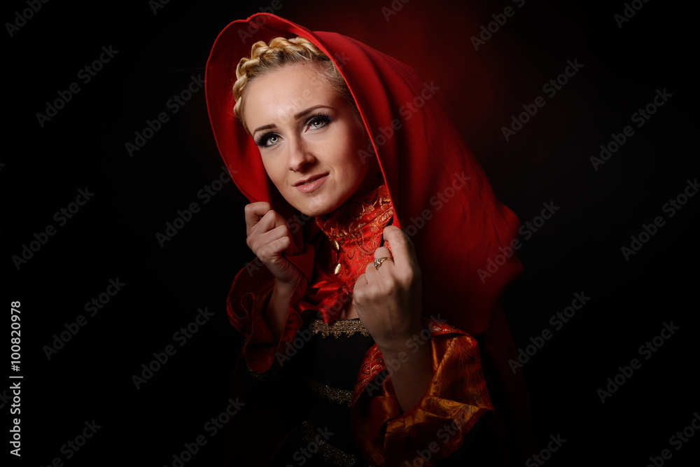 beautiful woman with red cloak posing in studio beautiful woman with red cloak posing in studio