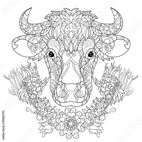Hand drawn doodle outline cow head decorated with ornaments.Vector zentangle illustration.Floral ornament.