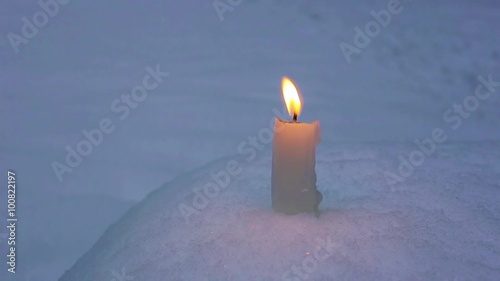 Candle on snow