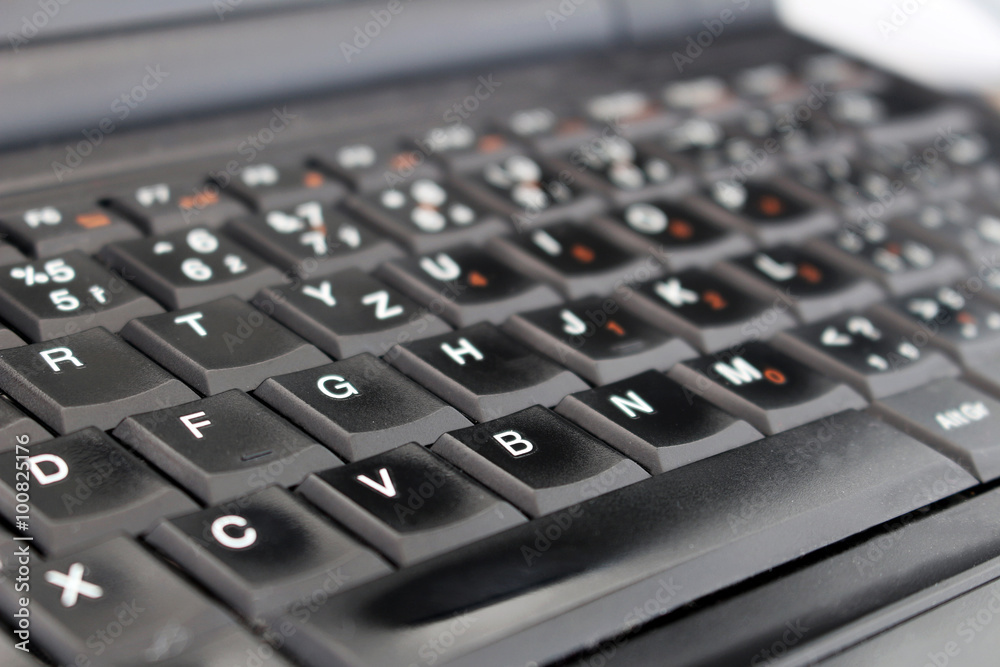 Detail of black laptop keyboard at office Detail of black laptop keyboard at office
