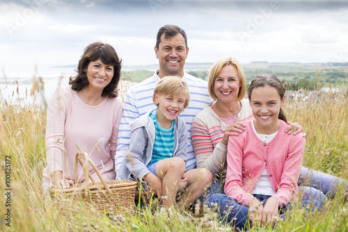 Family sitting on the sand dunes