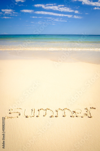 Conceptual image with summer sign in a beach sand