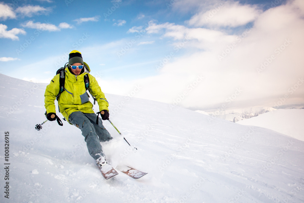 Man snowboarding on snow in the mountains