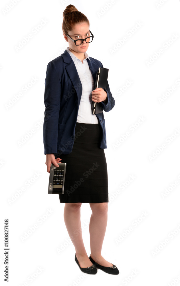 Full length of businesswoman in glasses standing with laptop and calculator.Isolated on a white background Full length of businesswoman in glasses standing with laptop and calculator.Isolated on a white background