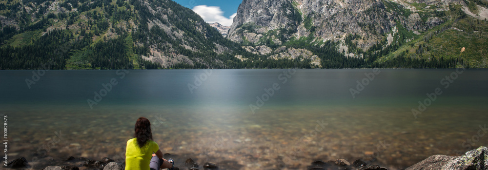 Woman is watching the lake at Grand Teton National Park, Wyoming