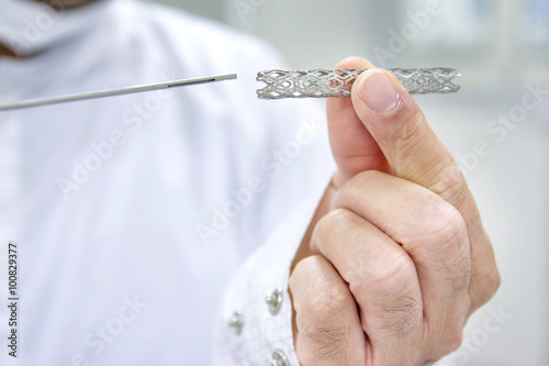 Man Holding Heart Stent In Hand 