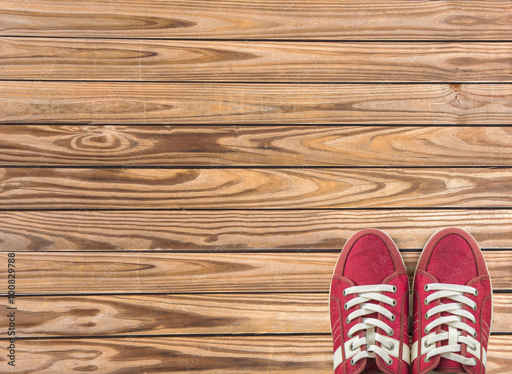 colorful shoes set on wooden background with copy space. Top view. colorful shoes set on wooden background with copy space. Top view.