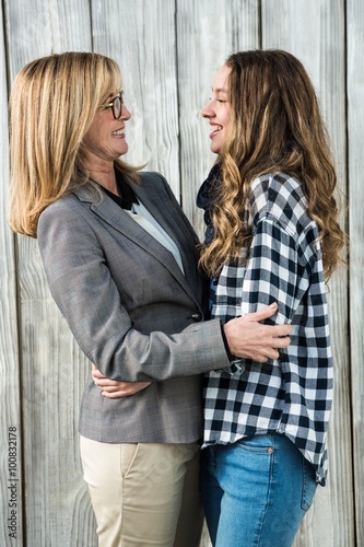 Mother and daughter smiling