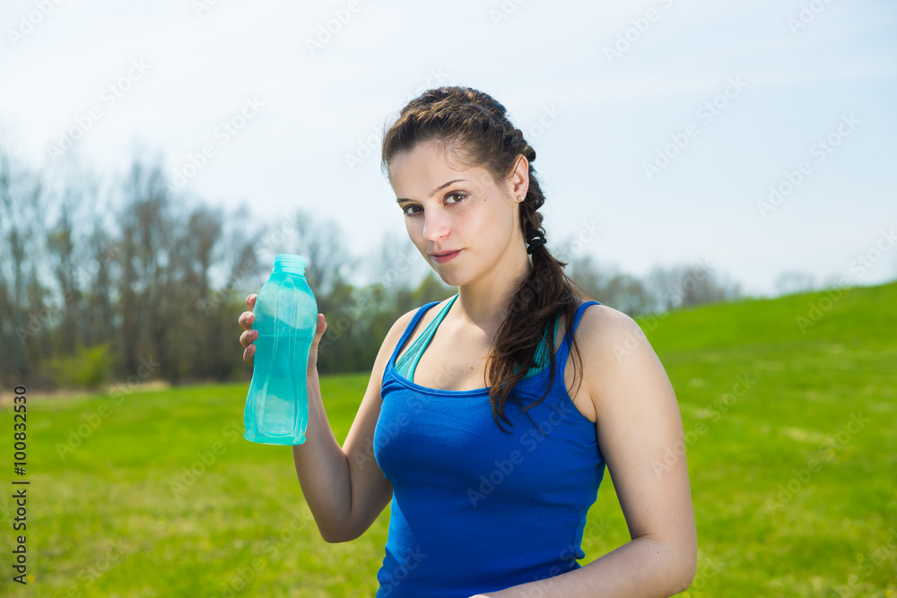 Healthy lifestyle a beautiful young woman going to drink some water on fitness workout . Healthy lifestyle a beautiful young woman going to drink some water on fitness workout .