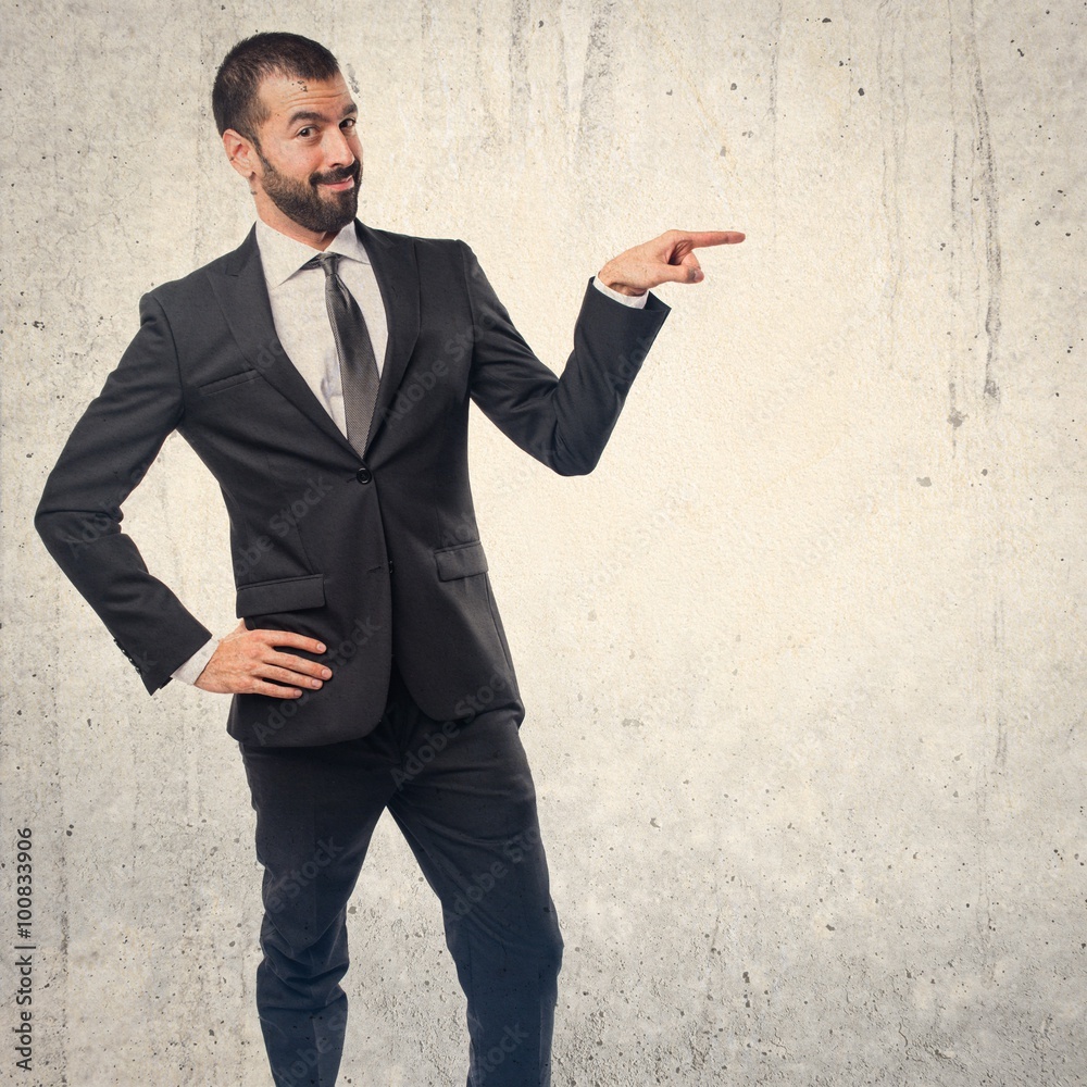 Businessman pointing to the lateral