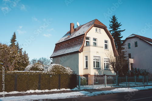 Suburban house with a light covering of snow