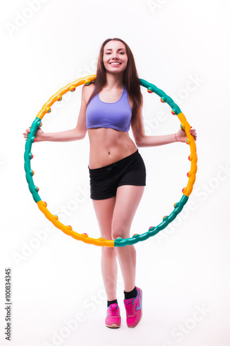 Young woman doing exercises with hoop on white background. © F8  \ Suport Ukraine