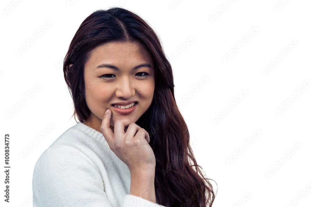 Smiling Asian woman with hand on chin looking at the camera Smiling Asian woman with hand on chin looking at the camera