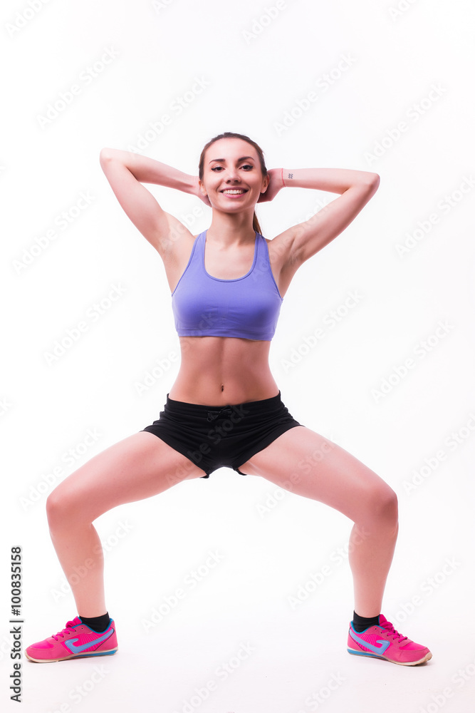 Young woman doing fitness exercise on white isolated background. Young woman doing fitness exercise on white isolated background.