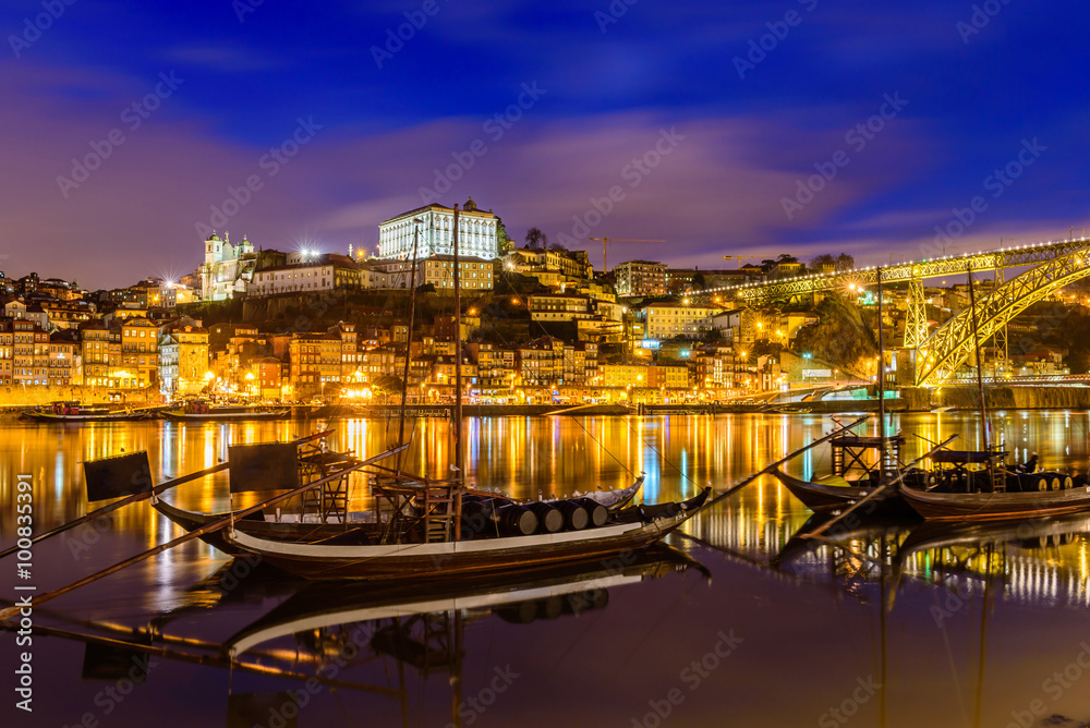 old town cityscape on the Douro River with traditional Rabelo boats, Porto, Portugal.