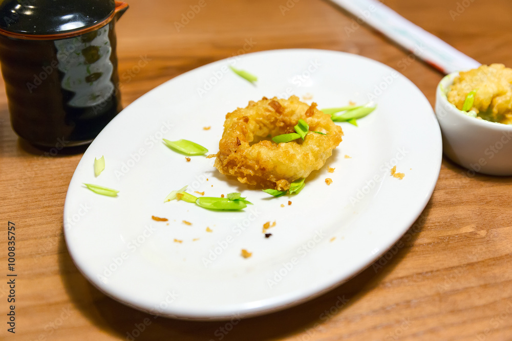 The remains of squid in batter. The remains of a sumptuous dinne The remains of squid in batter. The remains of a sumptuous dinne
