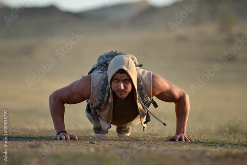 athletic young man on dusty field