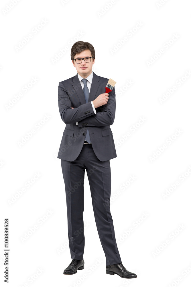 Young businessman with a brush Young businessman with a brush