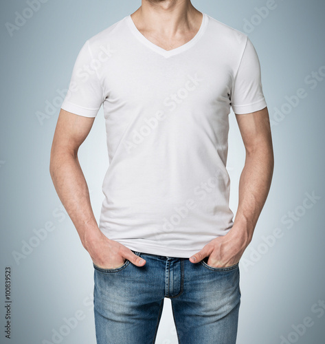 Man with hands in jeans pockets