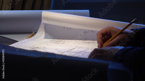 Engineer checks the construction drawings