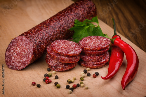 salami sausages on a wooden background