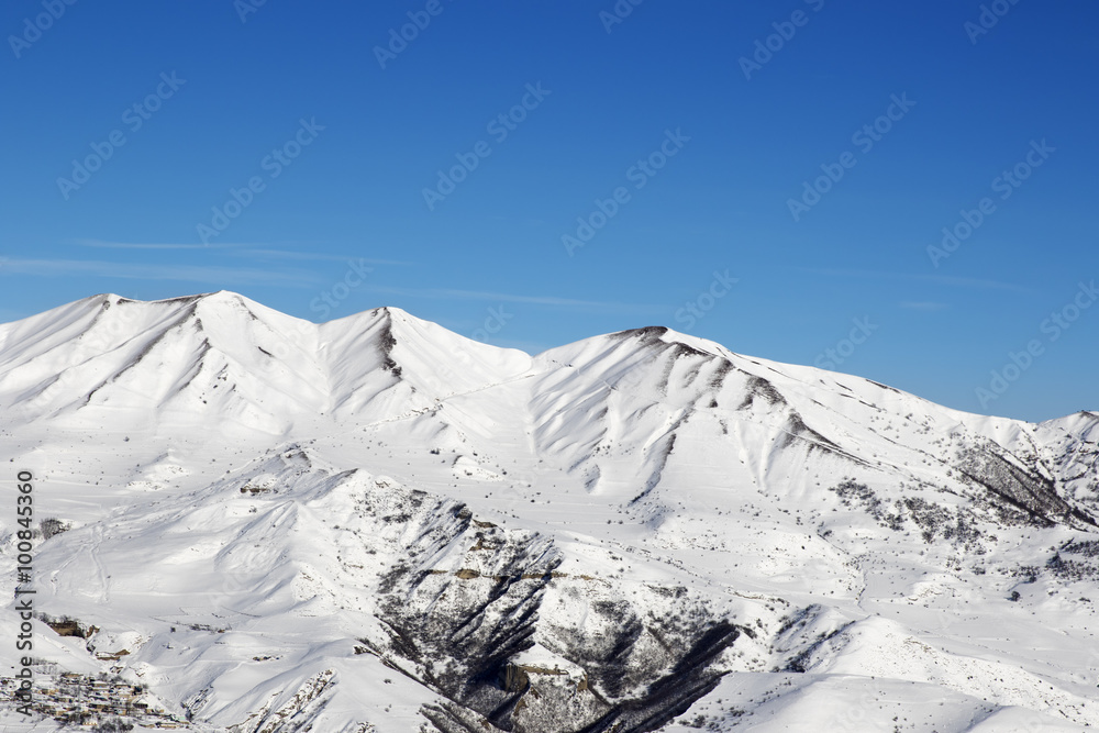 Snowy winter mountains at nice sun day