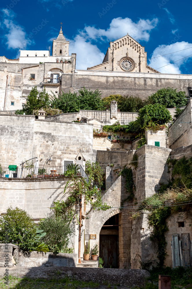 Street view of ancient town Sassi di Matera and Duomo - Italy