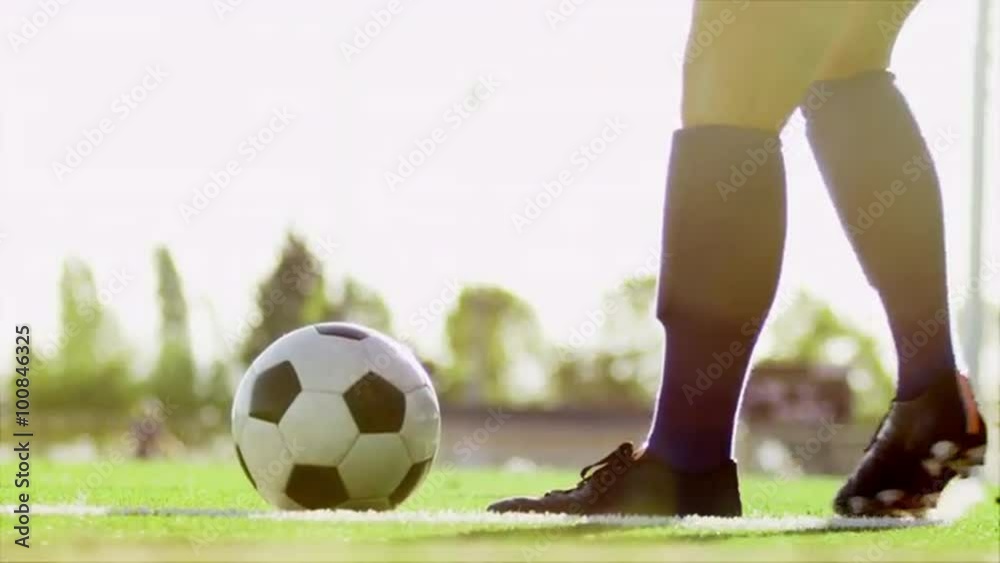 Close up of a soccer ball being kicked back into play
