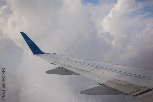 airplane wing sky clouds
