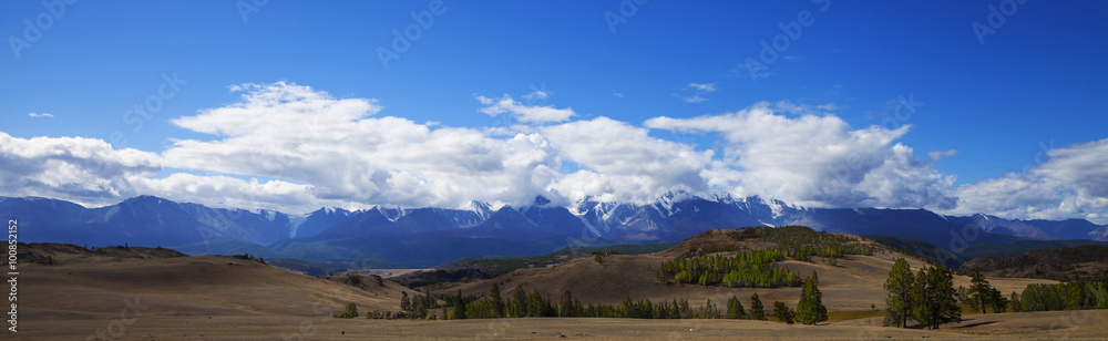 Snowy mountain peaks panorama