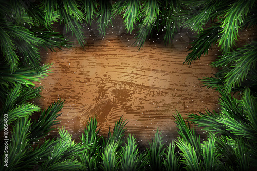 Christmas pine wreath on wooden background