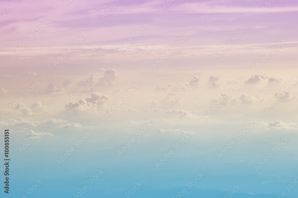Fantastic background with rose pink sky and clouds from airplane