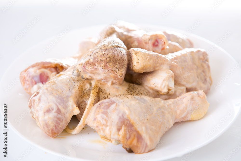 raw chicken drumsticks on white background raw chicken drumsticks on white background
