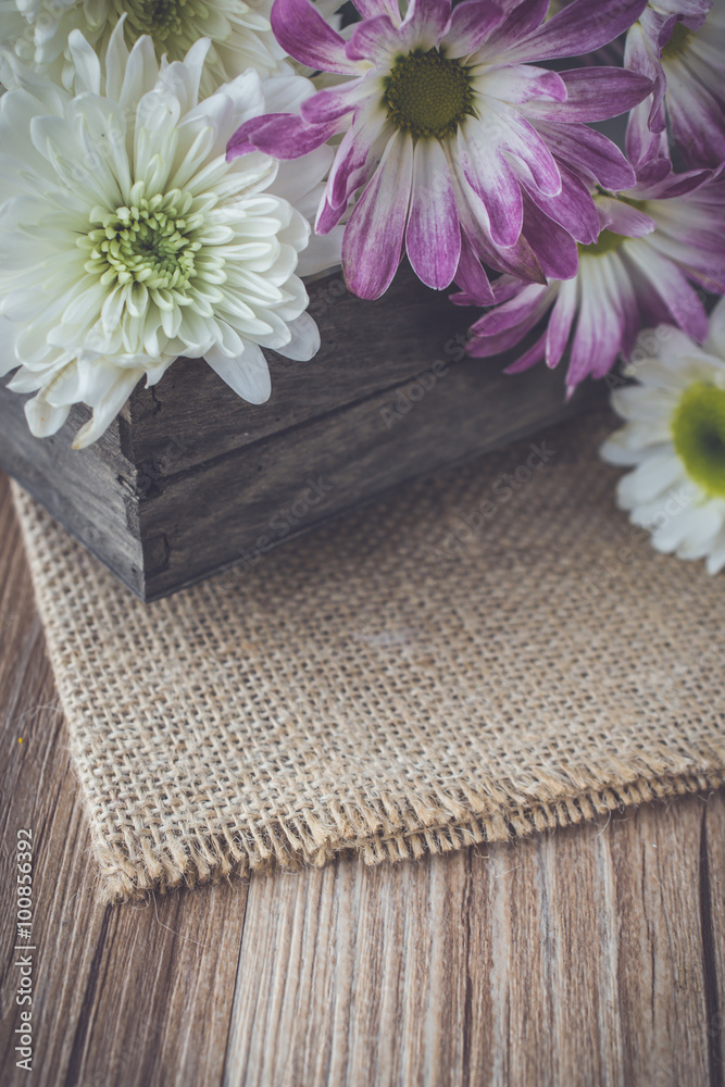 flowers on tray and sackcloth with blank space in vintage tone flowers on tray and sackcloth with blank space in vintage tone
