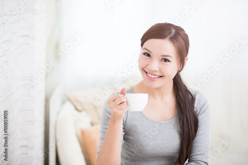 woman holding cup