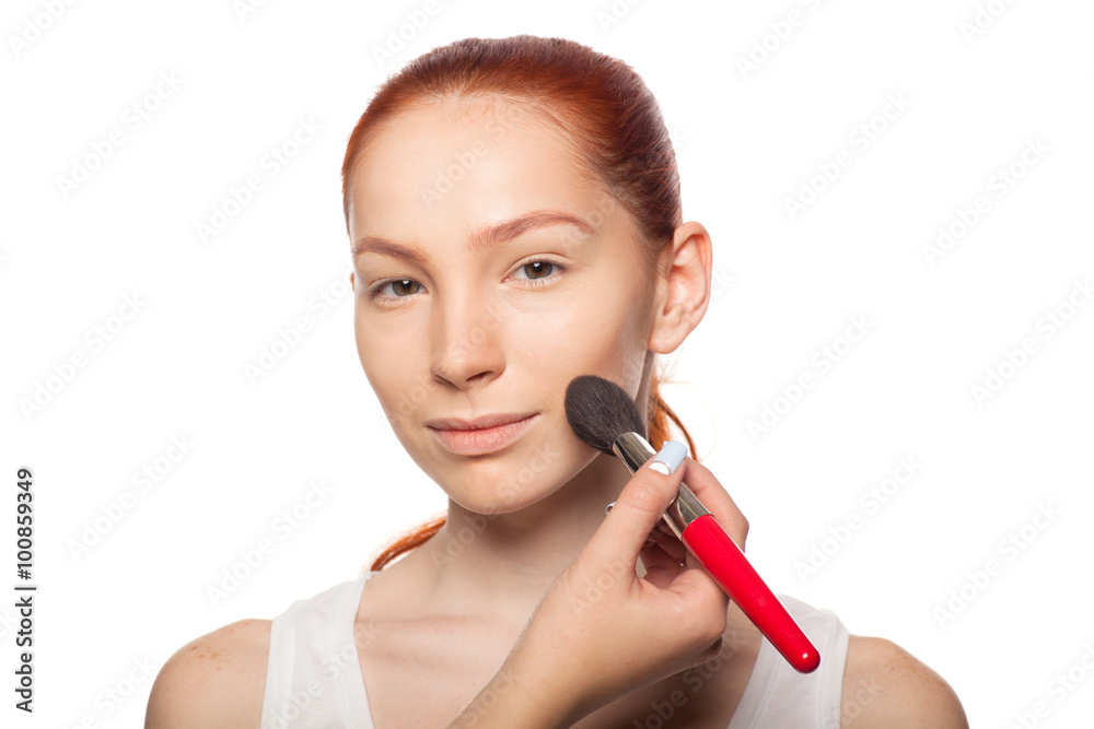 Professional Make-up artist doing glamour with red hair model makeup. Isolated background. Professional Make-up artist doing glamour with red hair model makeup. Isolated background.