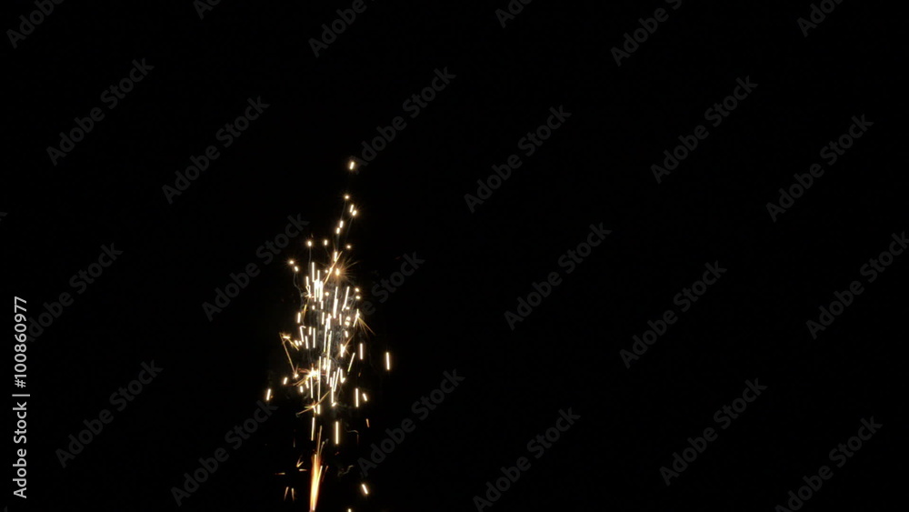 Real burning glowing golden yellow red sparks lights background isolated over black. Burning abstract fireworks sparkle. Full HD, 1080p.