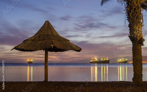 Nocturnal view on the Red Sea from central beach of Eilat - famous resort and...