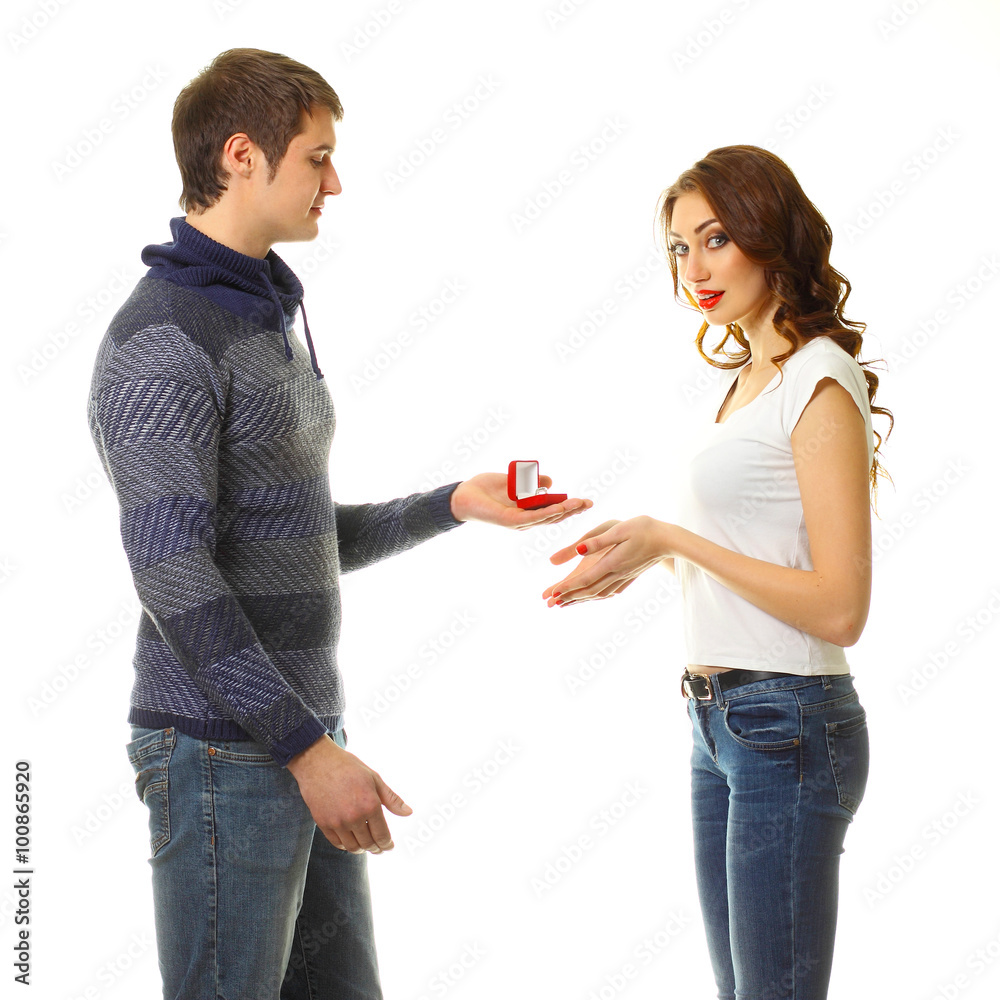 The young man makes a proposal to marry the girl. A man makes a gift to the woman he loves. The young man makes a proposal to marry the girl. A man makes a gift to the woman he loves.